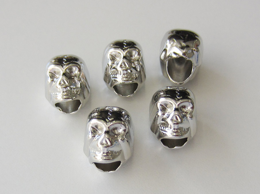 Silberfb. Kordelstopper aus Metall  in Totenkopf Form