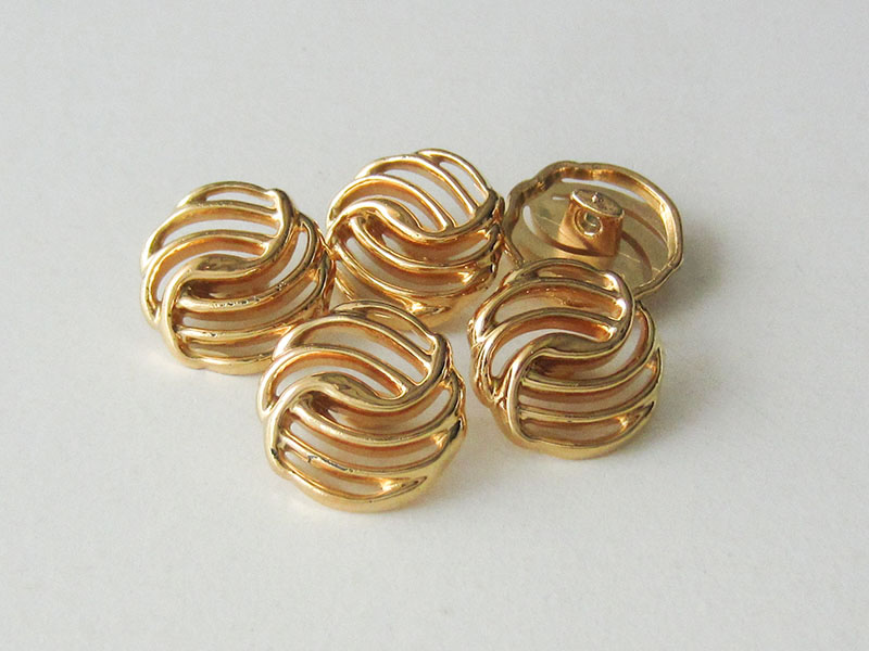 Elegante glänzend goldfarbene Ösen Kunststoffknöpfe mit Durchbruch