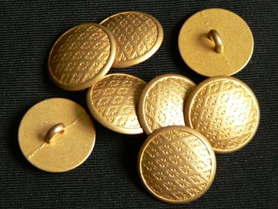 Schöner goldfarbener Knopf
