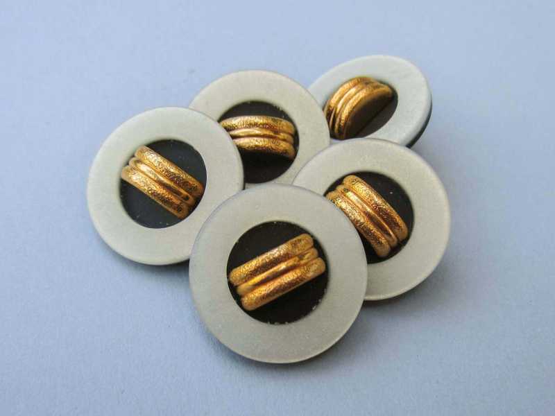 Gold beige schwarzer Knopf mit goldfarb. Applikation