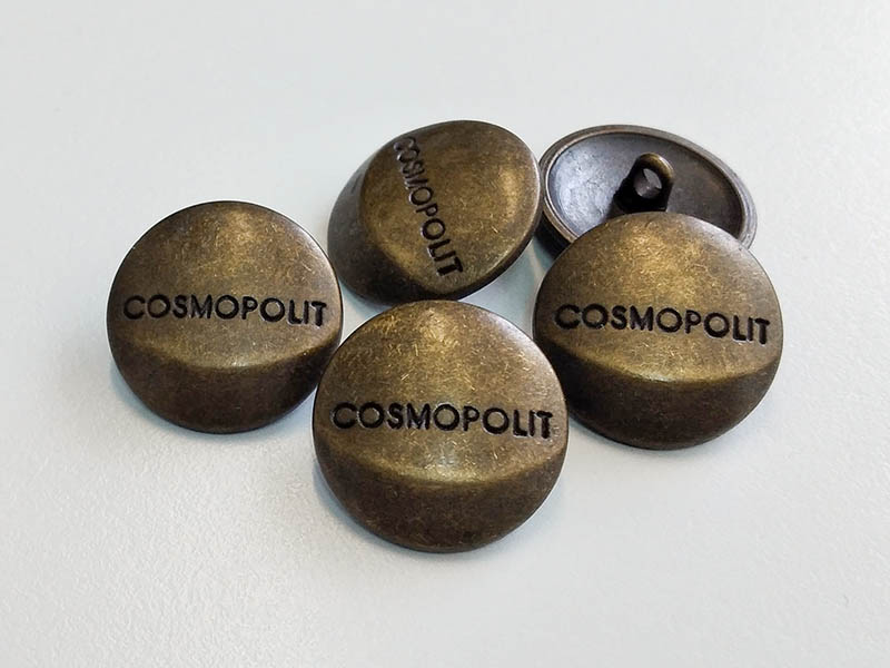 Altmessingfarbener Metallknopf "Cosmopolit"