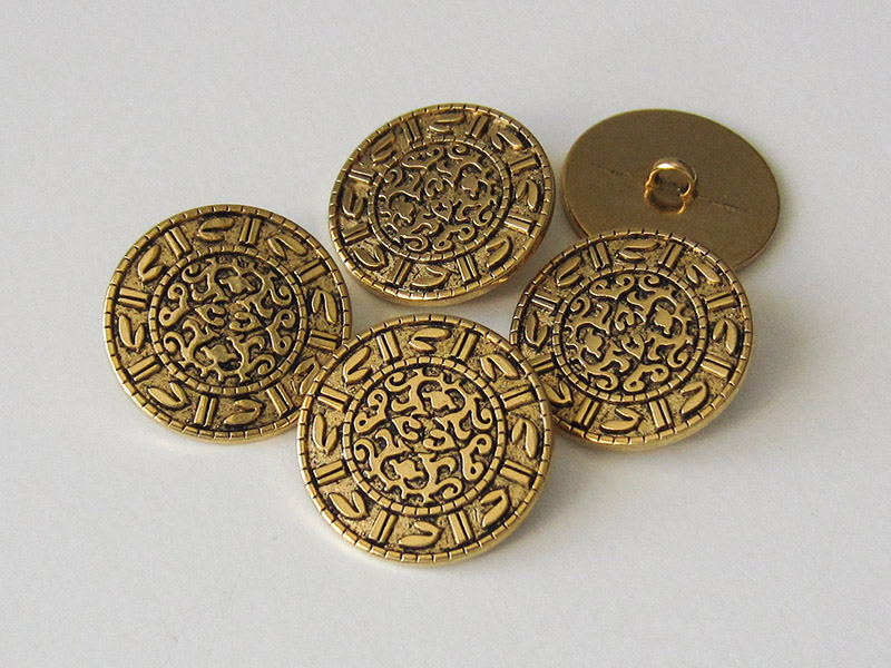 Interessante altgoldfarbene Knöpfe