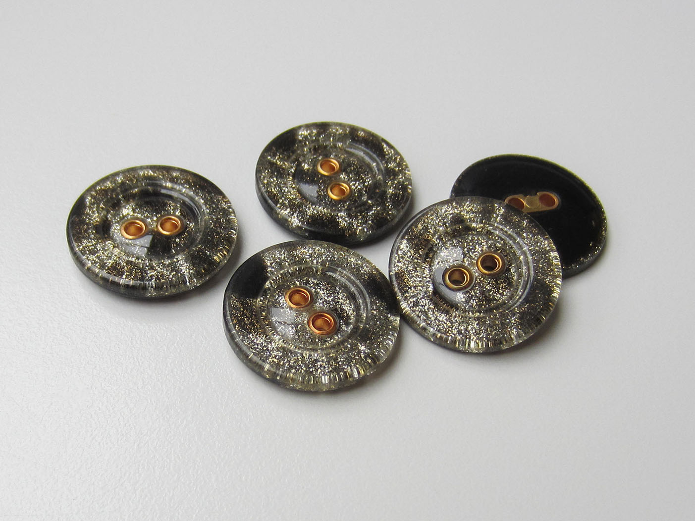 Edler schwarzer Kunststoff Knopf mit Gold Glitzer