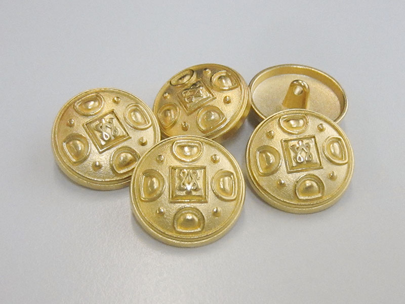 Eleganter Metallknopf mit Öse in matt Goldfarben