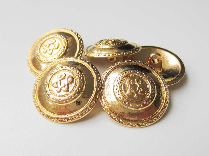 Goldfarbener Metall Knopf mit Symbol & Zierbändern