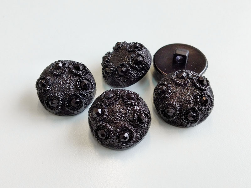 Wunderschöne, schwarz funkelnde Glitzerköpfe aus Kunststoff