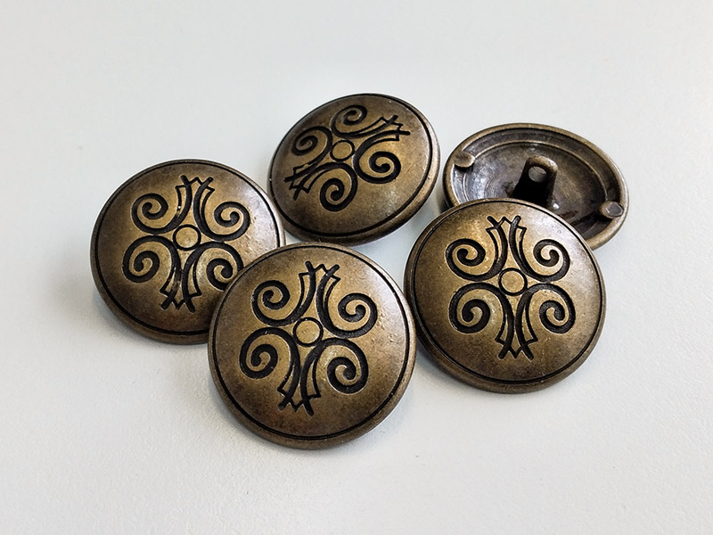 Metallknopf mit volkstümlichem Motiv