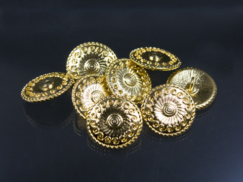 Goldfarbener Metallknopf mit Sonnenmotiv