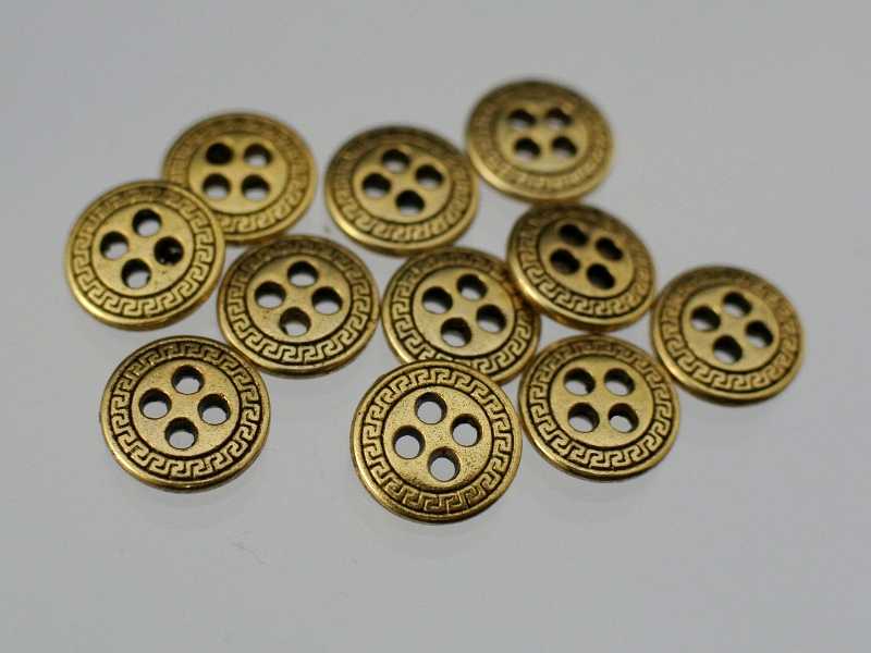 Altgoldfarbener Metallknopf mit Mäanderborte
