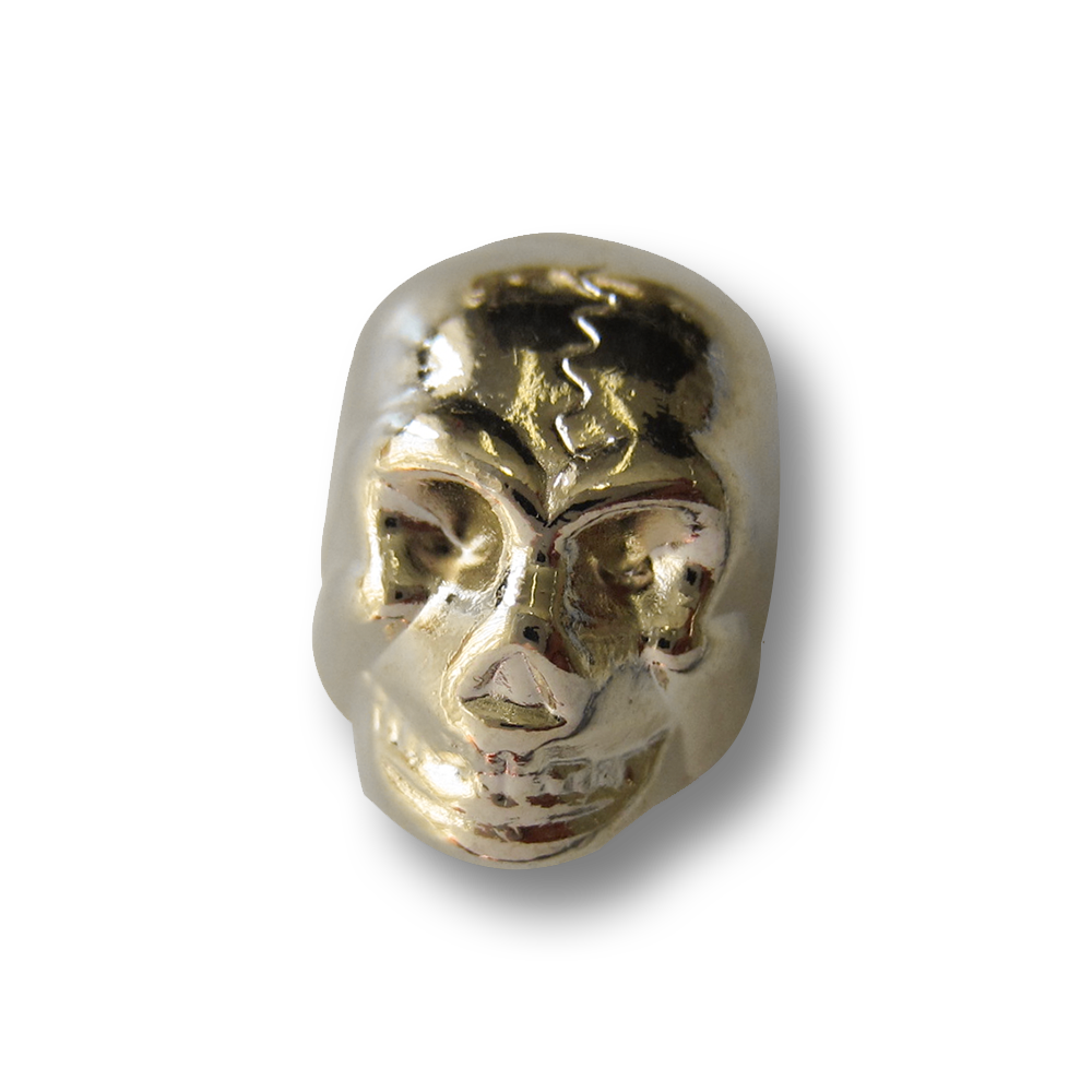 Goldfarb. Kordelstopper aus Metall  in Totenkopf Form