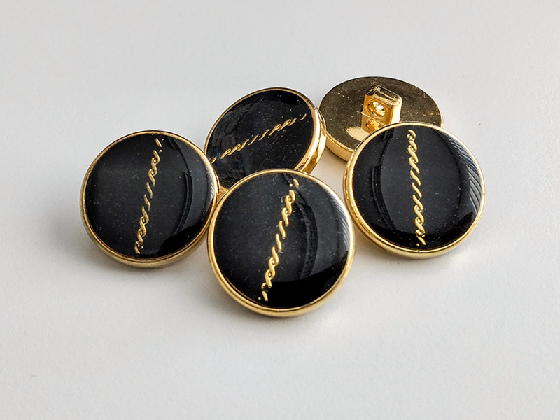 www.knopfparadies.de - 6310gs - Gold-schwarze Kunststoffknöpfe - B-WARE