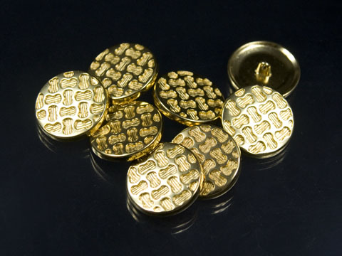 Goldfarbener Designerknopf mit tollem Muster
