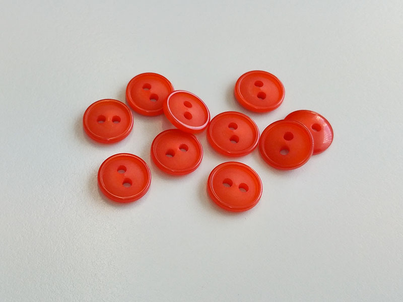 www.knopfparadies.de - 6438or - kleine Kunststoffknöpfe, knallig orange eingefärbt