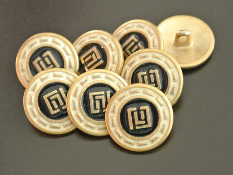 Schwarz-creme-goldfarbener Metallknopf
