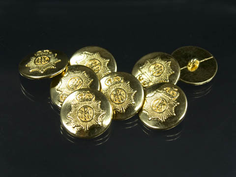Goldfarbene Knöpfe mit interessantem Emblem