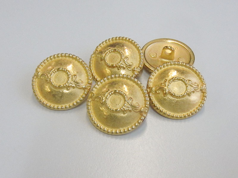 Goldfarbene Metallknöpfe