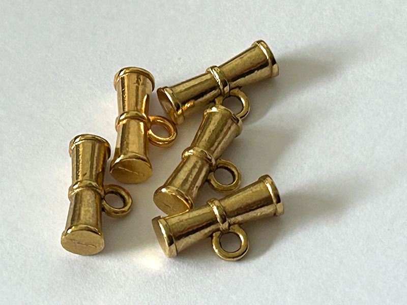 Kleine Metall-Knebelknöpfe altgoldfarben