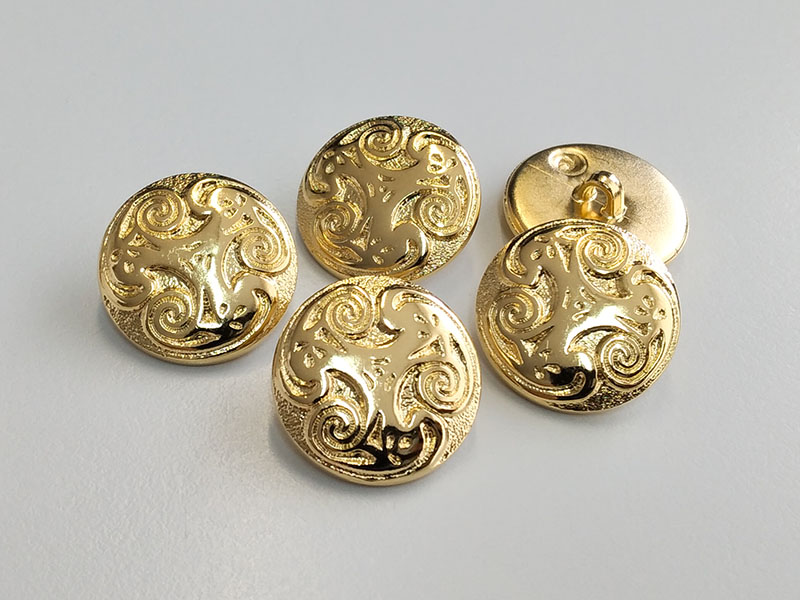www.knopfparadies.de - 6659gg - Glänzend goldfarbene Kunststoffknöpfe mit Spiralmuster