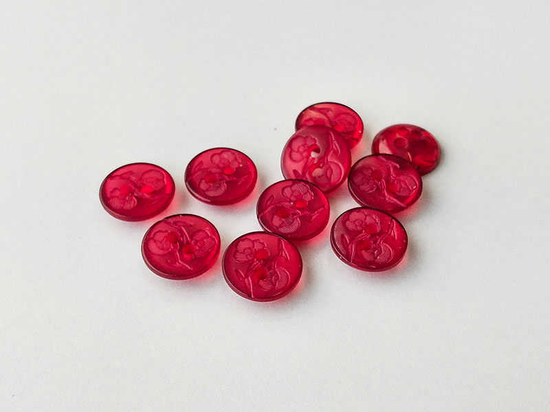 www.knopfparadies.de - 1001ro - Transparent rote Kunststoffknöpfe mit zwei Löchern