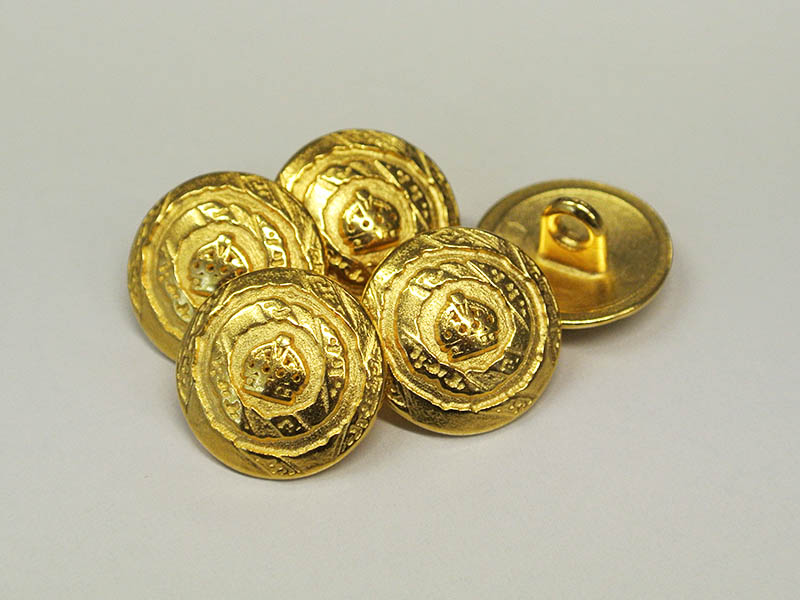 Glänzend goldfarbener Knopf mit Krone