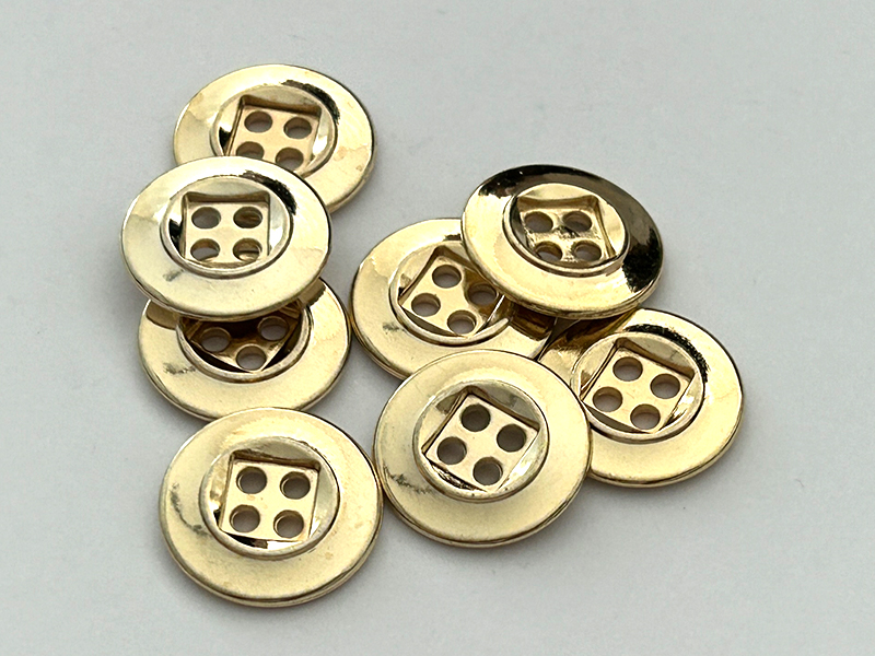Metallknöpfe glänzend goldfarben mit quadratischer Vertiefung