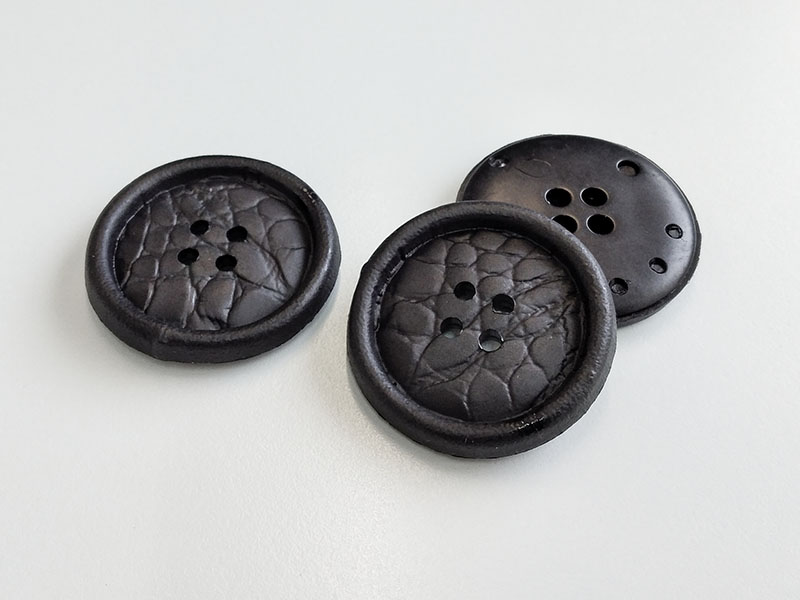 www.knopfparadies.de - 3912sc - Schwarze, günstige Kunststoffknöpfe mit Lederstruktur - B-WARE