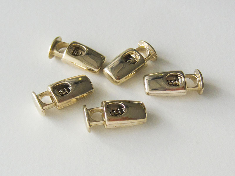 www.knopfparadies.de - 5857go.- kleine Kordelstopper aus Metall in gold