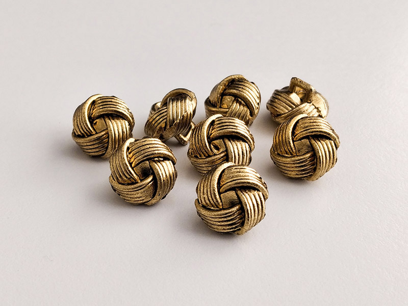 www.knopfparadies.de - 4599ag - Altgoldfarbene, leichte Kunststoffknöpfe, fast wie kleine Knoten