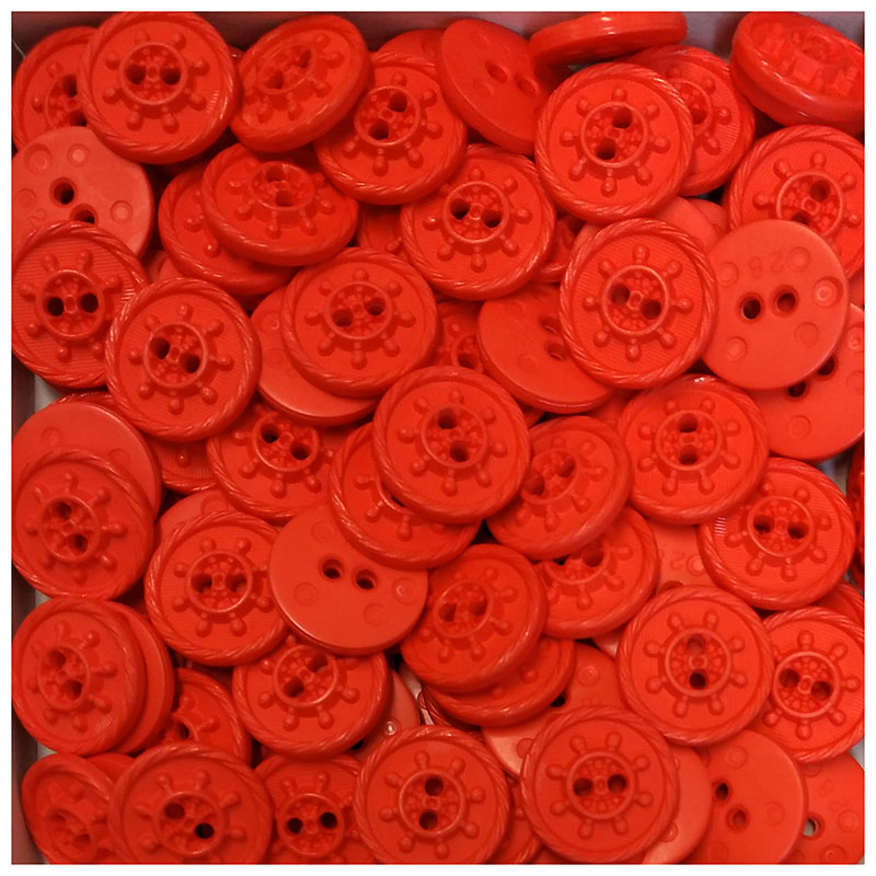 Neon-orange-rote Kunststoffknöpfe mit Steuerrad-Motiv