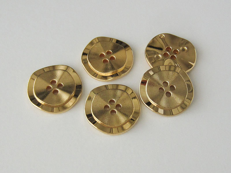 www.Knopfparadies.de - 1578go - Gewellte Kunststoffknöpfe in goldener Metall Optik