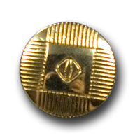 Goldener Metallknopf mit abstraktem Muster Goldener Metallknopf mit abstraktem Muster