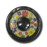 Süßer dunkelgrauer Knopf mit winzigen bunten Blüten Süßer dunkelgrauer Knopf mit winzigen bunten Blüten